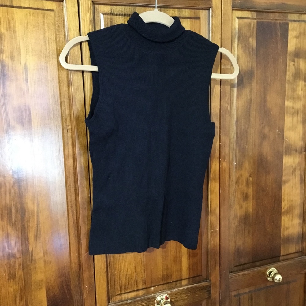 Woman’s turtleneck sleeveless blouse